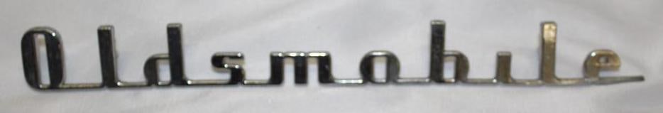 1941 Oldsmobile Trunk Emblem Script: 11" x 1"