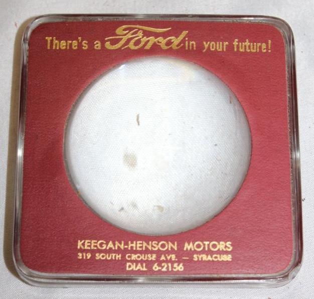 Ford "There's a Ford In Your Future" Advertising Magnifying Paperweight: Keegan - Henson Motors. 3.75" x 3.75" x 1.5"