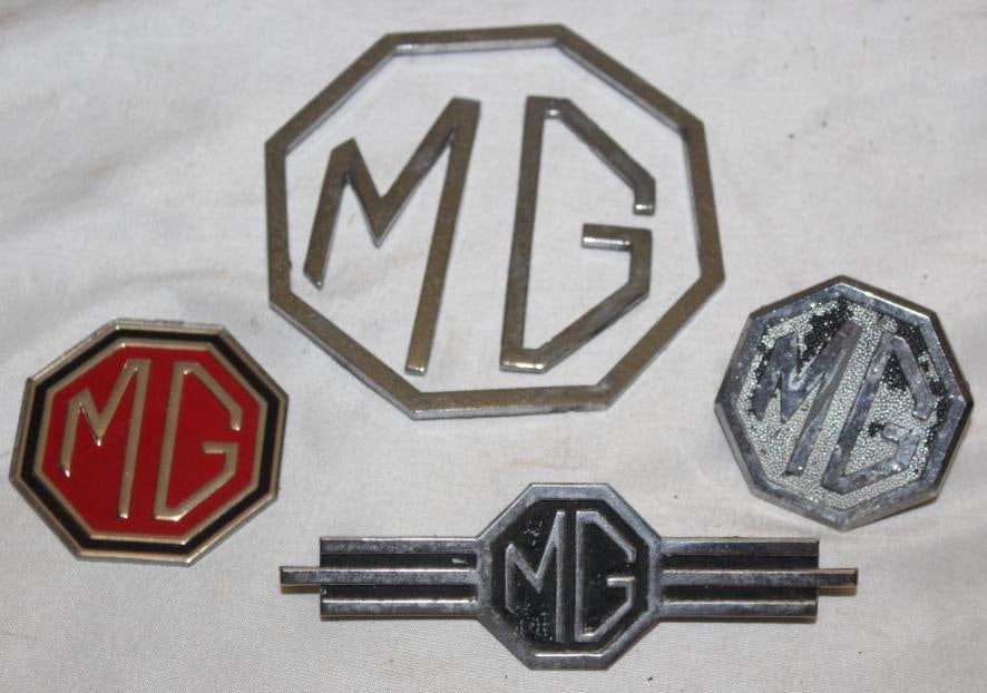 Group of 4 MG Emblem Badges: largest 4" x 4"