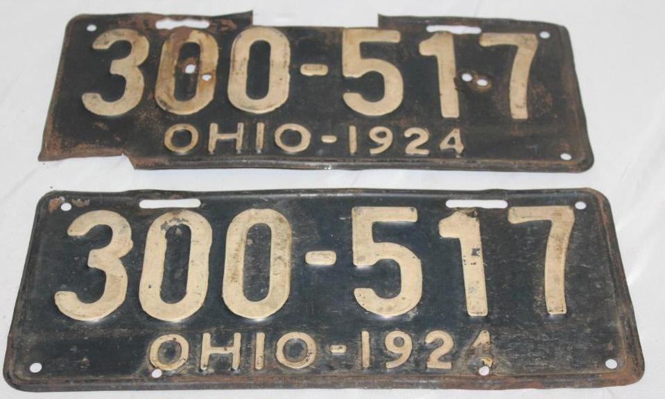 Pair of 1924 Ohio License Plates: both plates have extra holes, one plate has been modified, 13.5" x 5.75" each
