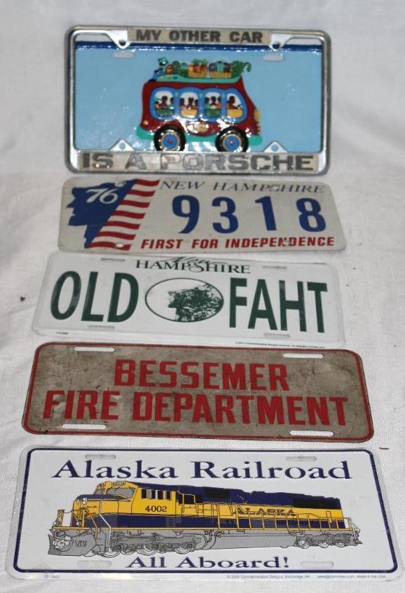 Group of 6 Alaska, New Hampshire Souvenir, Bessemer Fire Dept License Plates: 12" x 6"; Sandals Carribean Foundation Donation License Plate, Porsche License Plate Frame