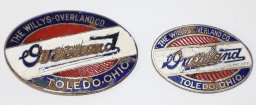 Group of 2 1911-1926 Willy's Overland Radiator Emblem Badges: both have touch ups, largest 2.5" x 1.5"