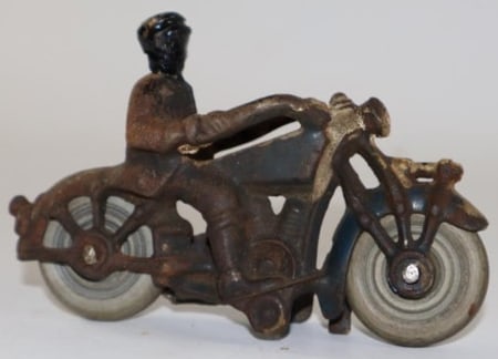 Cast Iron Toy Motorcycle: 4.5" x 1.5" x 3", it has rubber tires and has some repaint