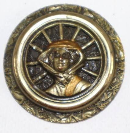 Figural Button w/ Woman in Front of Tire: 1.5" diameter