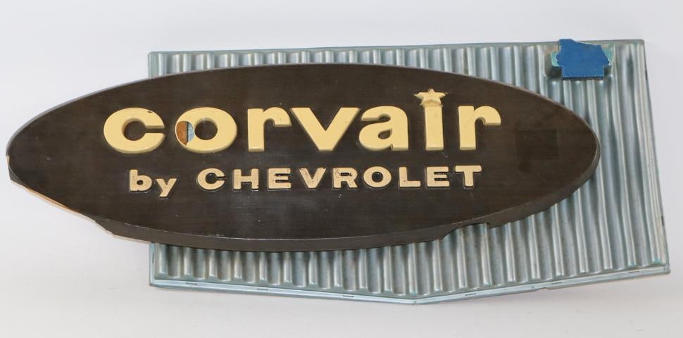 1960's Corvair by Chevrolet Advertising Dealership Display Sign: there are a couple of cracks and is broken at top right corner and left edge, 30" x 12" x 4"