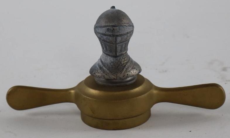 1923-1926 Willys Knight Radiator Mascot Hood Ornament: Mounted to brass base. The tip of the helmet is chipped. 7.5" x 4" x 2.5"