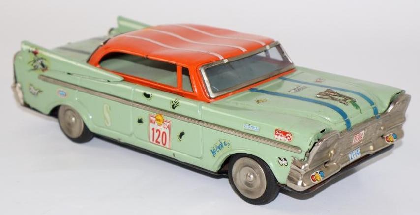 1950's Green Sedan Friction Tin Toy Car from Japan: with racing decals, 9"