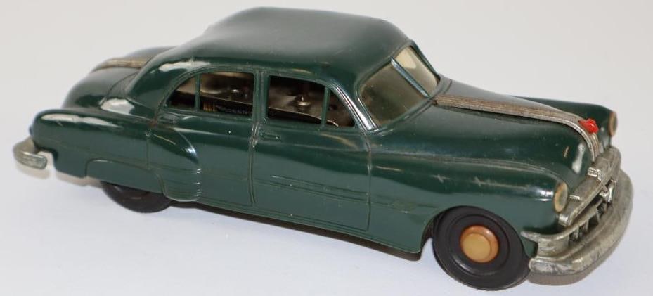 1950's -1960's A.M.T. Pontiac Sedan Wind Up Friction Car Tin Toy Car: 7.50" body is plastic