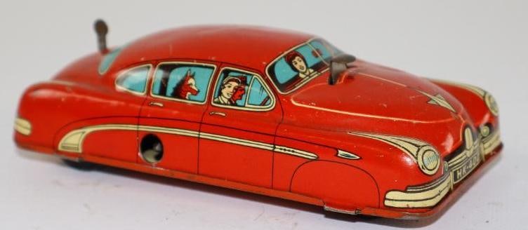 1950's -1960's Red Sedan w/ Passenger Graphics Wind Up Tin Toy Car From US Zone Germany: 5.25" missing winding key