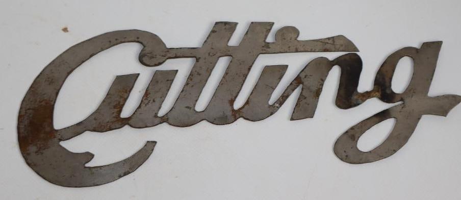 Cutting Automobile Radiator Emblem Script (1 of 2)