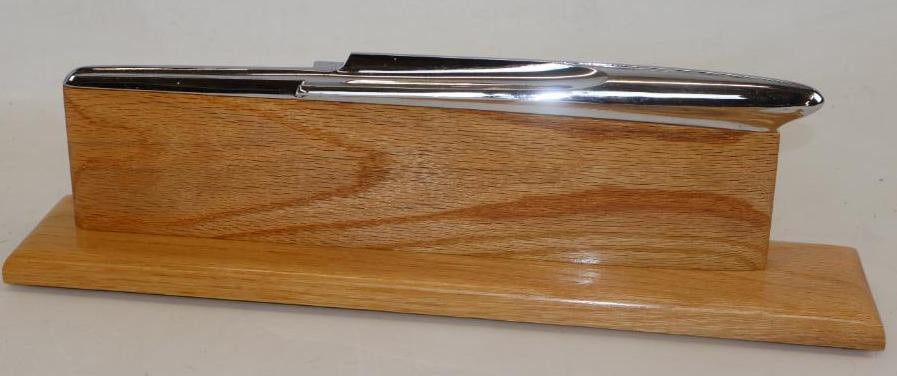 1957 Pontiac Automobile Radiator Mascot Hood Ornament: Mounted on custom oak base, 18.5" x 3.50" x 5.50" including base