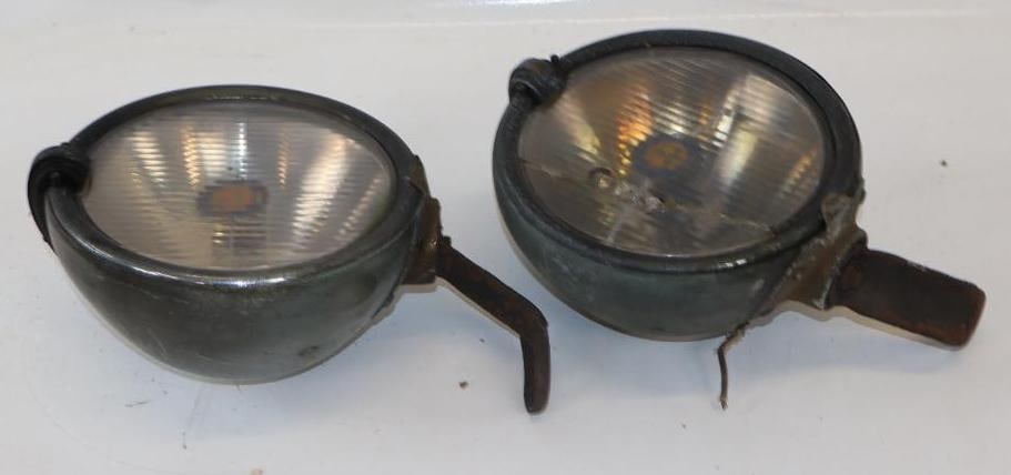 Pair of 1930's Trippe Safety Spotlights: 7.5" diameter, 12" x 8.5" x 5" overall, both with original mounting brackets, one has a cracked lense