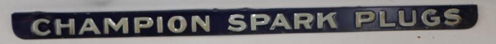 CHAMPION SPARK PLUGS EMBOSSED TIN STRIP SIGN. (1 of 2)