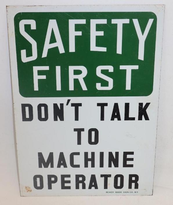 SAFETY FIRST DON'T TALK TO MACHINE OPERATOR TIN SIGN.: 10" X 7". MAKER MARKED READY MADE SIGN CO., NEW YORK. SINGLE SIDED TIN. CONDITION: EXCELLENT COLOR & GLOSS WITH MINOR SURFACE SCRATCHING. LIGHT WEAR ALONG THE OUTER EDGE.