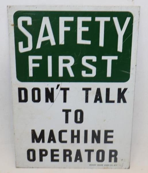 SAFETY FIRST DON'T TALK TO MACHINE OPERATOR TIN SIGN.: 10" X 7". MAKER MARKED READY MADE SIGN CO., NEW YORK. SINGLE SIDED TIN. CONDITION: EXCELLENT COLOR & GLOSS WITH MINOR SURFACE SCRATCHING. LIGHT WEAR ALONG THE OUTER EDGE.