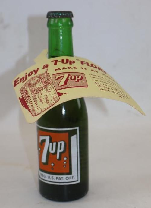 ORIGINAL SEVEN UP BUBBLE GIRL POP BOTTLE WITH 7-UP FLOAT ADVERTISING NECK TAG. (1 of 3)