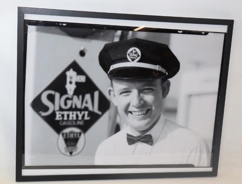 SIGNAL GASOLINE SERVICE STATION ATTENDANT FRAMED PHOTOGRAPH.: Black & White Photograph of a 1930's Signal Gasoline Service Station showing portrait of Signal Service Station Attendant, Los Angeles, California. Photograph features large portrait of Service Statio