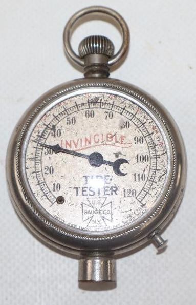 INVINCIBLE TIRE TESTER FOB STYLE TIRE GAUGE.: 3" 1930'S FOB STYLE TIRE GAUGE INVINCIBLE TIRE TESTER. METAL BODY WITH GLASS FACE. CONDITION: VERY GOOD CONDITION OVERALL SHOWING LIGHT SURFACE WEAR ON THE METAL FACE. IN WORKING CONDITION WITH NO HEA