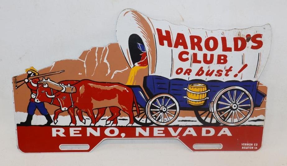HAROLDS CLUB OR BUST! PAINTED TIN FIGURAL LICENSE PLATE TOPPER.: 14" X 7.25" SINGLE SIDED TIN. MAKER MARKED VERNON CO. NEWTON IOWA. CONDITION: EXCELLENT COLRO & GLOSS THROUGHOUT WITH ONLY MINOR SURFACE SCRATCHING IN THE OUTER FIELD. EXCELLENT CONDITION GRAPHICS WIT