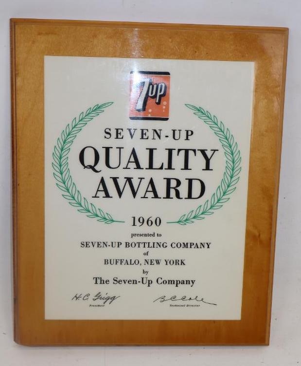 SEVEN UP SODA POP 1960 QUALITY AWARD PRESENTATION PLAQUE.: 14" X 11". SINGLE SIDED WOOD AWARD PLAQUE FROM 1960 PRESENTED TO SEVEN UP BOTTLING OF BUFFALO, NEW YORK. CONDITION: OVERALL EXCELLENT SHOWING LIGHT WEAR. OUTER EDGE SHOWS WEAR AT LOWER LEFT BUT OVERAL