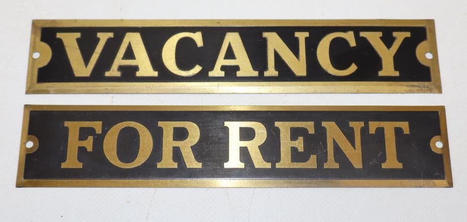 COLLECTION OF 2: VACANCY & FOR RENT STAMPED BRASS SIGNS.: 7" X 1.5" EACH. 1920'S STAMPED BRASS SIGNS SHOWING VACANCY & FOR RENT CONDITION: EXCELLENT CONDITION THROUGHOUT WITH ONLY MINIMAL SURFACE WEAR FROM STORAGE. OUTER EDGES AND MOUNTING HOLES ARE EXCELLEN