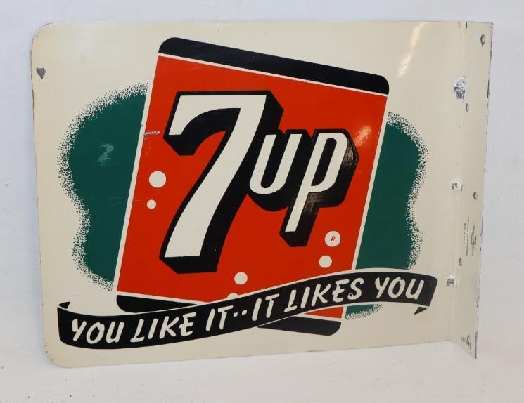 SEVEN UP YOU LIKE IT IT LIKES YOU TIN FLANGE SIGN.: 13" X 10". MAKER MARKED STOUT SIGN COMPANY. CONDITION: OUTSTANDING CONDITION THROUGHOUT EACH SIDE SHOWING LITTLE TO NO SURFACE WEAR WITH EXCELLENT COLOR & GLOSS. LIGHT WEAR ALONG THE OUTER EDGES AND N