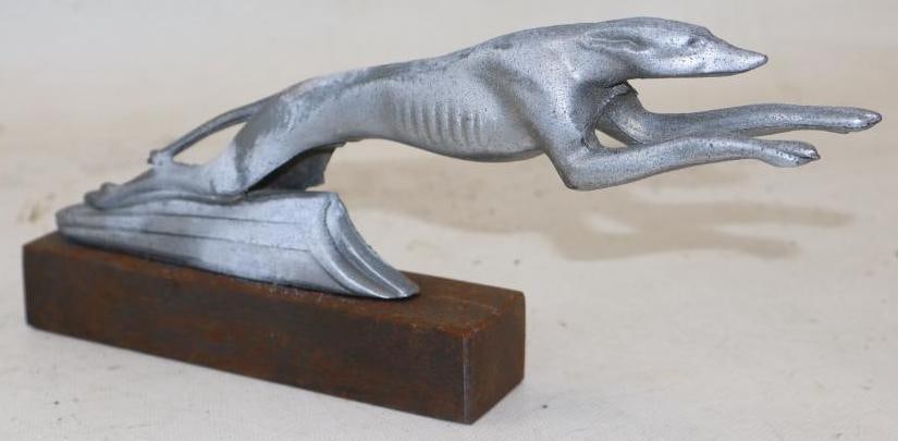 Leaping Greyhound Radiator Mascot Hood Ornament: 9.25" x 1.25" x 4" mounted to lead base, has been recast