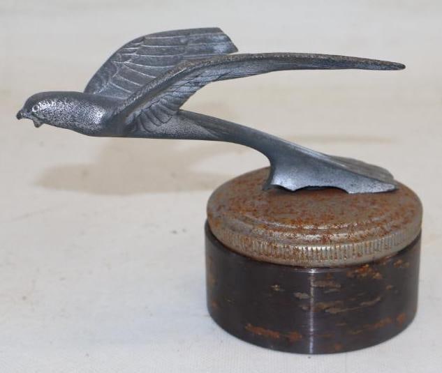 Flying Bird Radiator Mascot Hood Ornament: 3.50" x 6" x 4.50" mounted to lead base, one wing is broken