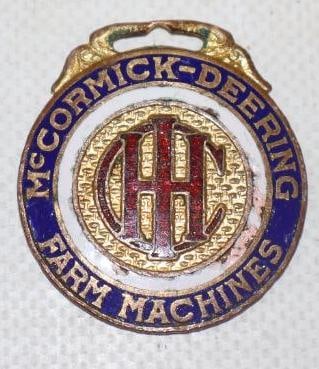 International Harvester McCormick-Deering Farm Machines Cloisonne Adverting Watch Fob (1 of 2)