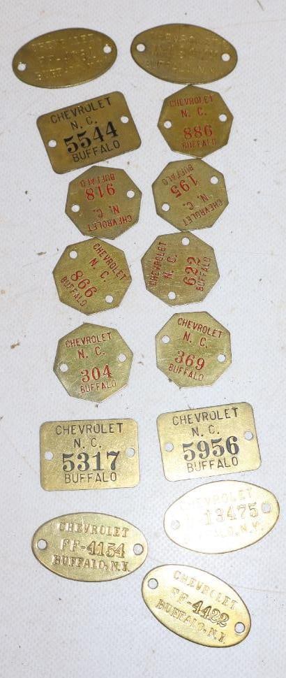 Group of 15 Chevrolet Brass Tags: 1.50" x 1" largest