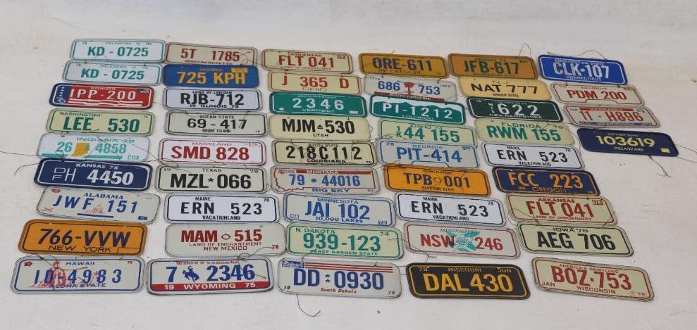 Group of 49 1970's Cereal Box Bike License Plates: 4.75" x 2" largest