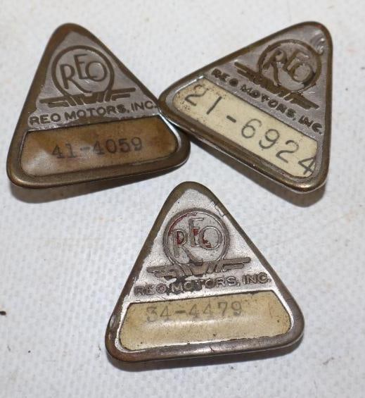 Group of 3 REO Motors Incorporated Employee Pin Back Badges: 1.25" x 1" each