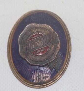 1927-1929 Chrysler Radiator Emblem Badge: 2" x 1.5", cloisonne, there is damage to the enamel