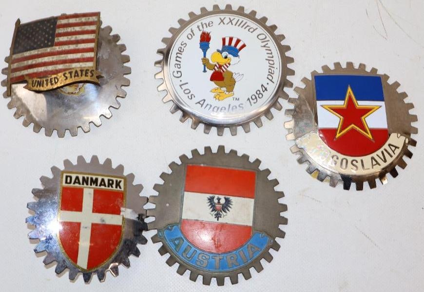 Group of 5 Austria, Danmark, Yugoslavia, US And 84 LA Olympics Radiator Badges: largest is 4" diameter