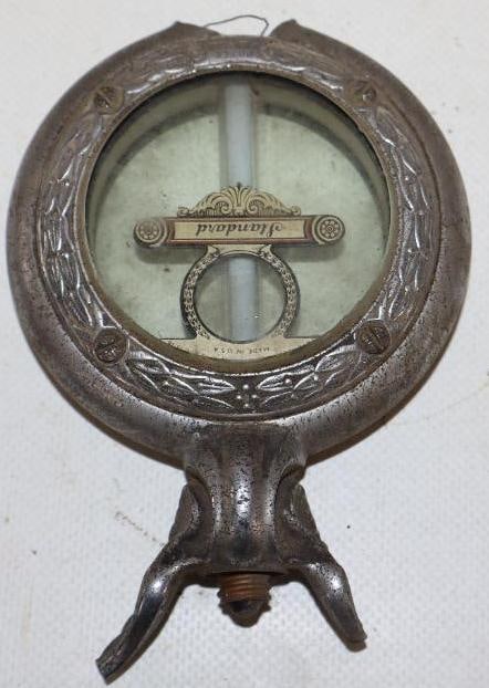 Standard Moto Meter w/ Winged Wheel: 3.25" x 5" is broken at the bottom and both wing tips