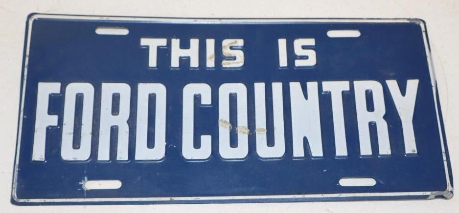 This is Ford Country Embossed Dealership Booster License Plate (1 of 2)
