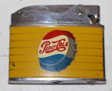 Pepsi-Cola Refillable Advertising Lighter: Is marked South Automatic Super Lighter. Is in great condition with light wear. 2" x 1.75"