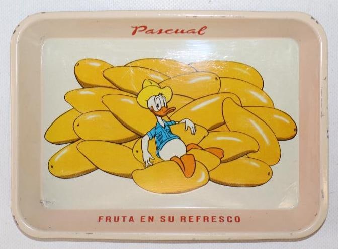 Donald Duck Sitting on Fruit "Fruit In Your Soft Drink" Soda Metal Advertising Tray: In great condition with some light scratching. Believed to be from Mexico. 5" x 7"