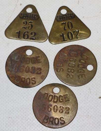 Group of 5 Dodge Brothers And Covered Wagon Brass Tags: largest is 1.25" x 1.25"