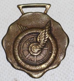 American Automobile Digest Winged Wheel Brass Watch Fob (1 of 2)