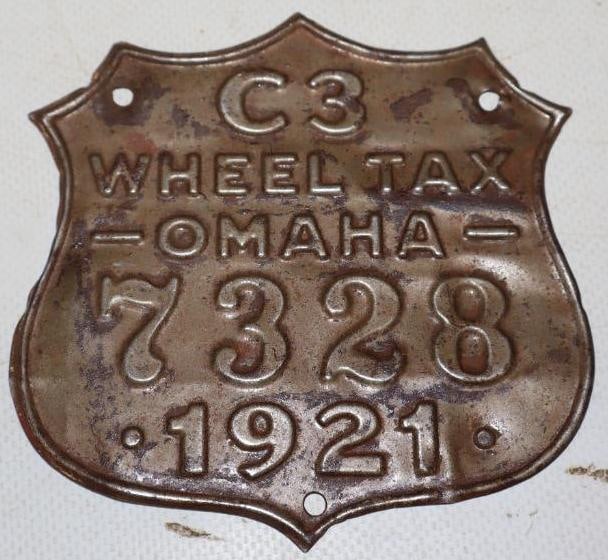 Embossed 1921 Shield Shaped Omaha Wheel Tax Tag: 4" x 4"
