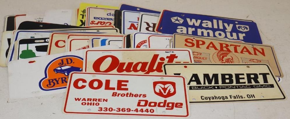 Group of 61 Plastic Dealership Booster Advertisement Plates: 12" x 6" each