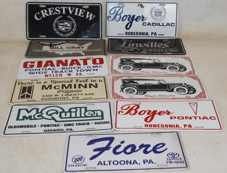 Group of 11 Cadillac, Oldsmobile, Buick And Pontiac Dealership Advertising Metal Booster License: 12" x 6" each