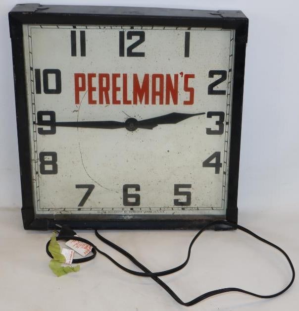 Perelman's Advertising Wall Clock: 14.50" x 14.50" x 3" clock does not work and a crack on bottom left corner