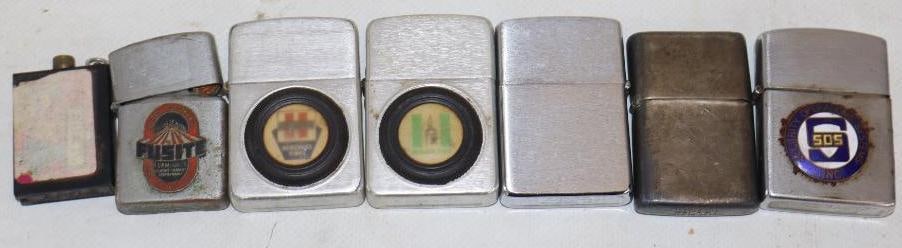 Group of 7 Zippo And Zippo Style Advertising Lighters: largest is 2.25" x 1.50"