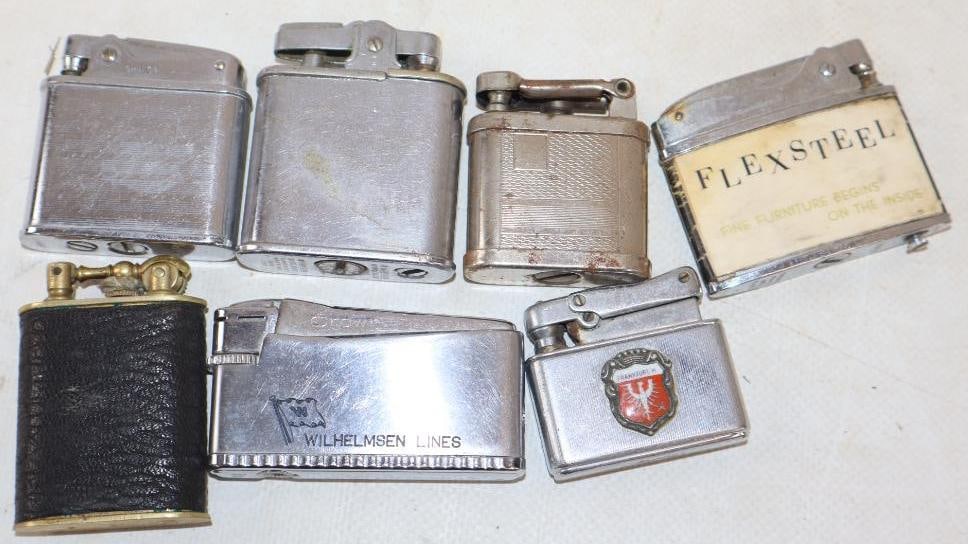 Group of 7 Zippo Style Advertising Lighters: largest is 2.50" x 1.25"