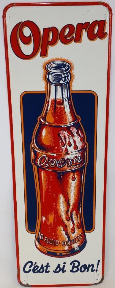Graphic Opera Soda SST Advertising Sign: This sign has good color and gloss throughout with some paint loss and scratches in the perimeter and lower corners. It is marked "No. 101-CCC." It is graded 8.5 and is 53.25" x 17.25"