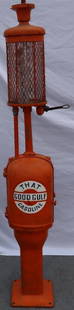 1921 Gilbert and Barker G&B Model 88 with Visible Attachment: This is an older repaint with a Gulf decal which has some tears to it. The glass cylinder is in good condition, and it is a solid pump overall. 98" x 16" x 14".
