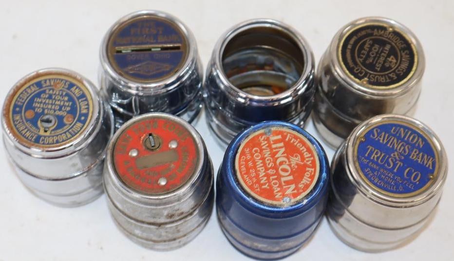 Group of 7 Barrel Shaped Advertising Coin Banks: 3 are missing bottoms. Largest is 2" x 2" x 2.5"