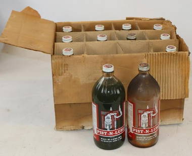 Group of 12 Pist-N-Lube Glass Quart Bottles in Original Box: Two bottles are empty. Box measures 11.5" x 14.5" x 9.5"